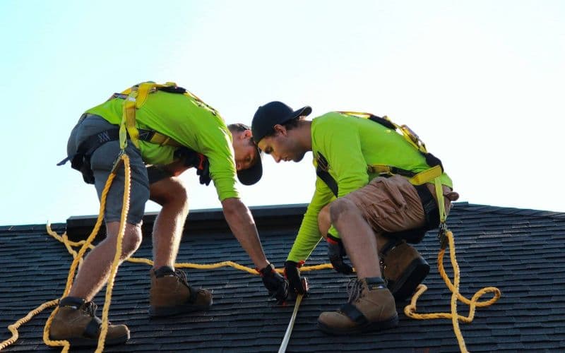 Roofing crew working on a residential roof